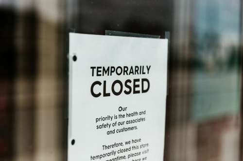 Temporarily Closed Sign On Door Photo