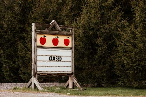 Closed Roadside Sign By Apple Orchard Photo