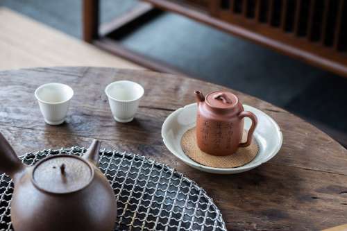 Teapot And Two Tea Cups On Wooden Table Photo