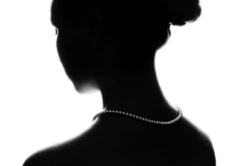Woman Silhouette With Pearl Necklace Photo