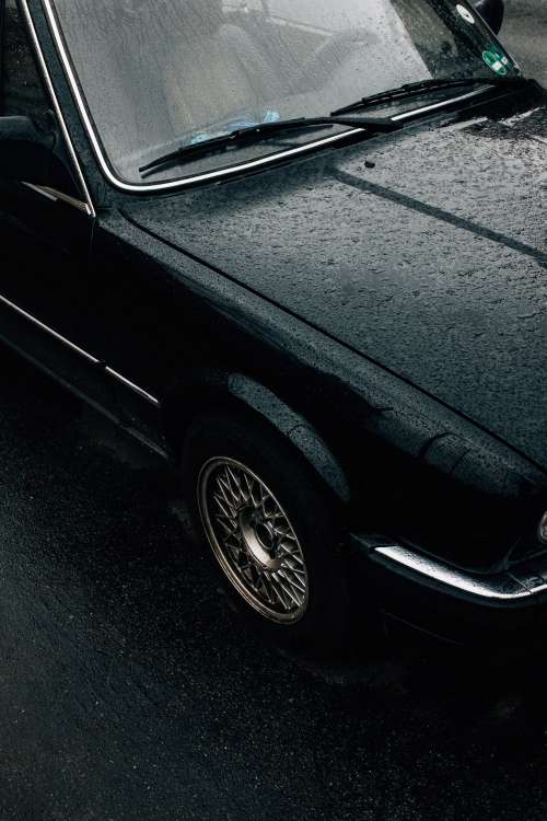 Rain-covered Vintage Car Photo