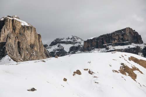 Rocky Mountenous Landscape Surrounded By Snow Photo