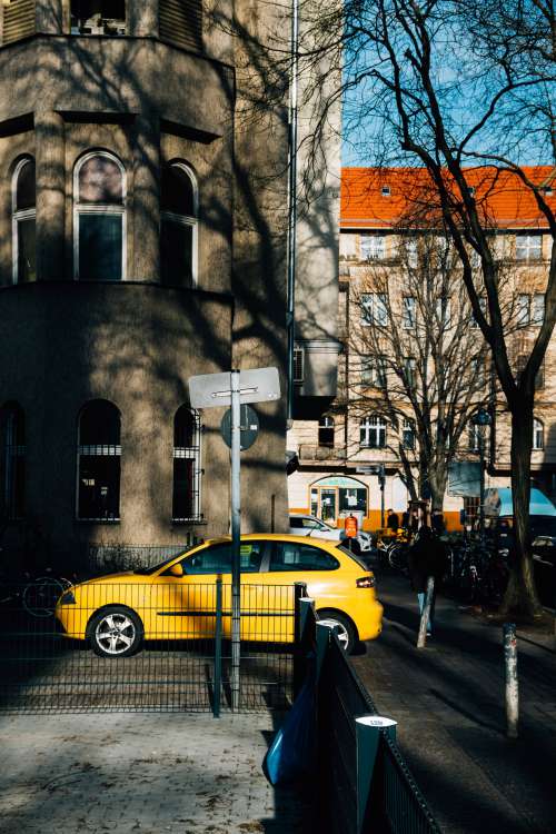 Yellow Car On City Street Photo