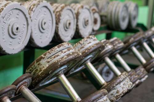 Rusty Weights On A Rack Photo