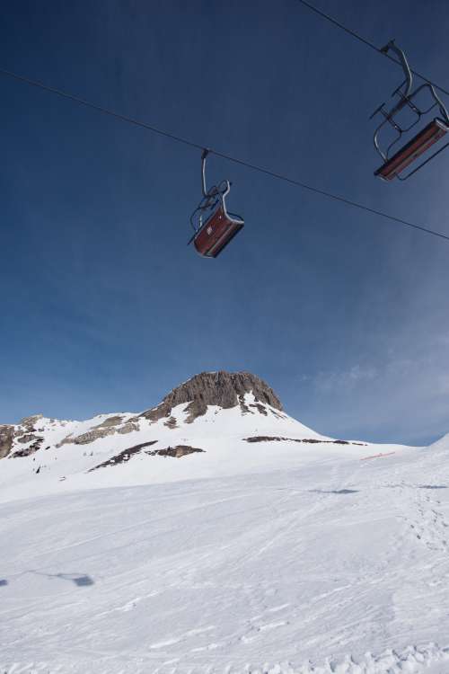 Empty Chairlifts On A Cable Photo