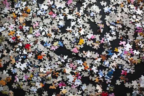 Puzzle Pieces On A Black Background Photo