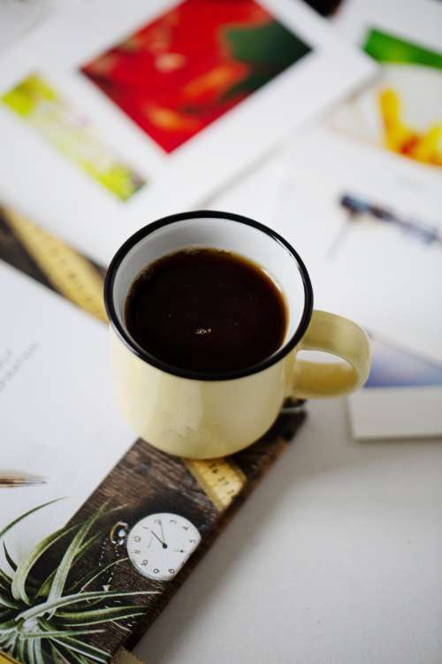 Black Coffee Set On Magazines Photo
