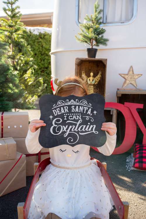 Little Girl Taking Christmas Photos Photo