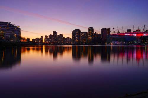 A City Skyline Under A Sunset Photo