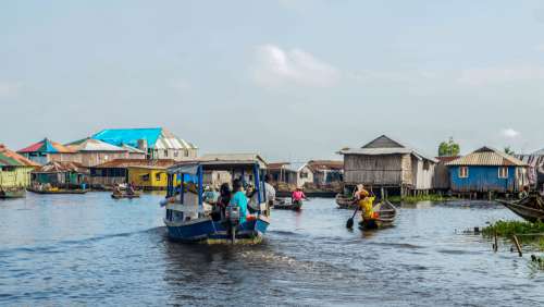 lake, lakeside town, ecotourism, pretty view, landscape, dugout, motorized boat, visitors, tourists, paddle