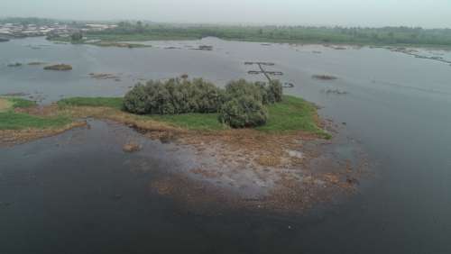 panoramic view, lakeside town, landscape, sky view, lake, river, greenery, environment, nature, ecosystem, island