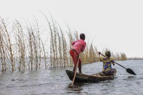 people, woman, boy, child, kid, fishers, work, family, mother, son, canoe, boat, landscape, river, lake, nature, environment