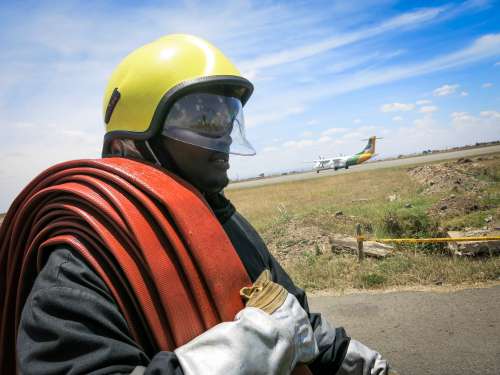 people, helmet, man, landscape, safety, vehicle, military, road, aircraft, pipe, firefighter, airport, work, focus