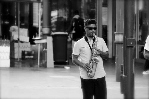 street performer music city saxophone