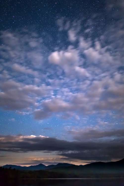 night sky clouds stars mountians