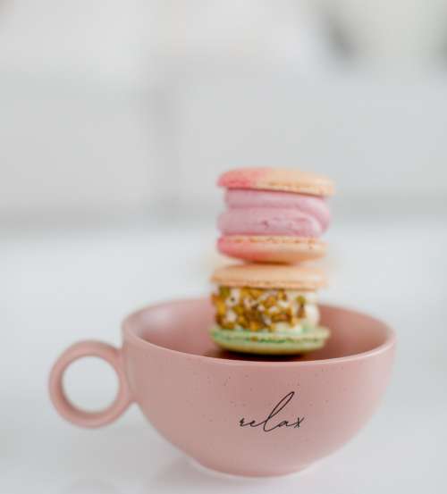 Pink Teacup Filled WIth Macarons Photo