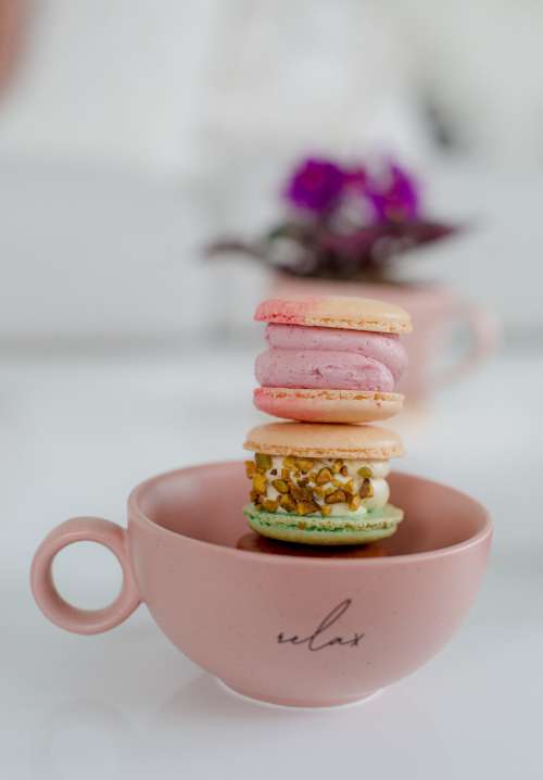 A Tower Of Macarons In A Teapot Photo