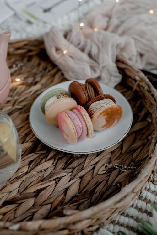 Plate Of Macarons On A Wicker Tray Photo