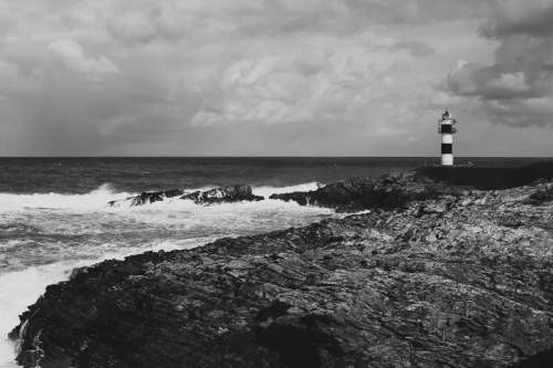 Lighthouse And Crashing Waves Photo