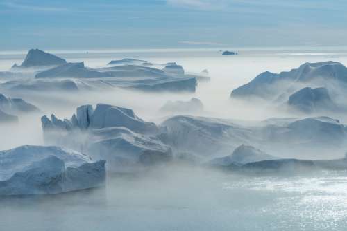 Fog Rolls Over Icey Glaciers Photo