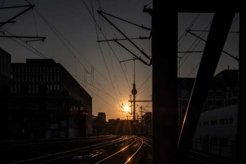 Sun Sets Over Empty Train Tracks Photo