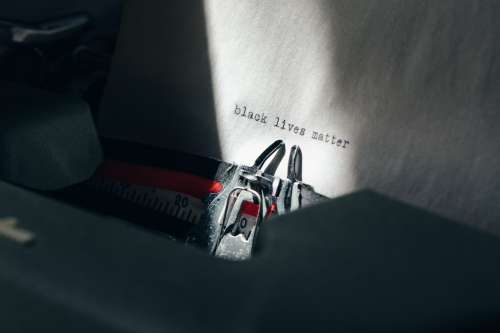 Angled View Of Typewriter With Black Lives Matter Photo
