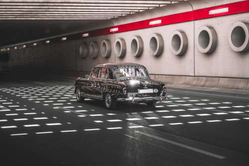 Vintage Car Driving Through Stunning Underpass Photo