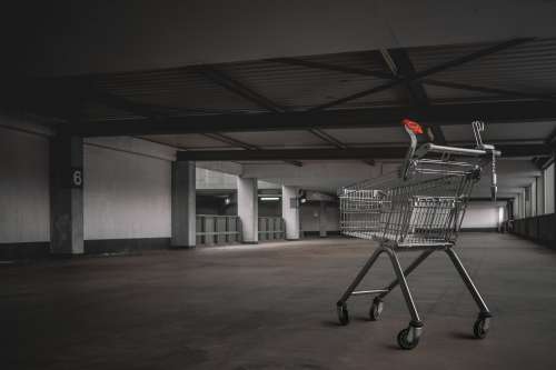 Abandoned Shopping Cart In Parking Lot Photo