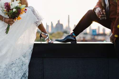 A Bride And Groom Show Off Their Style Photo