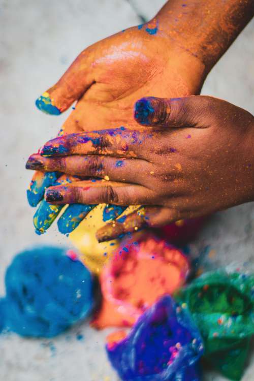 Two Hands Rubbing Powdered Paint Photo