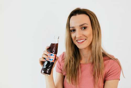 Young woman with Pepsi Cola bottle