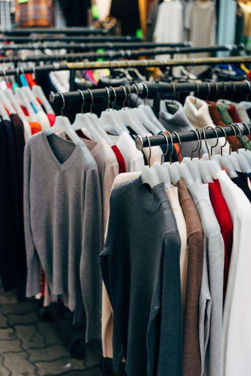 Clothes On A Rack In A Clothing Store Photo