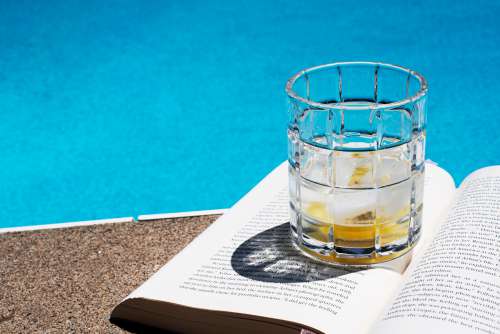 Drink Sat On A Book By The Pool Photo
