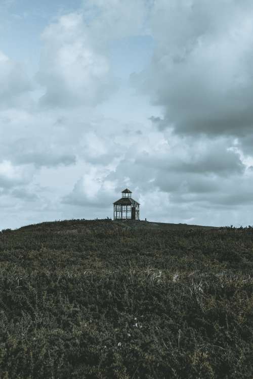 A Single Structure On A Hill Photo