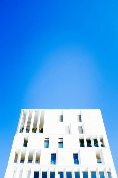 White Modern Building Beneath Blue Sky Photo
