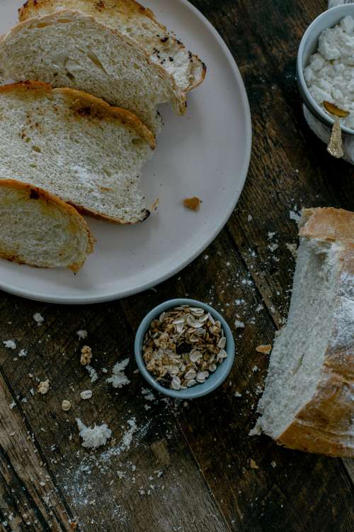 Fresh Baked Bread With Oats On Table Photo