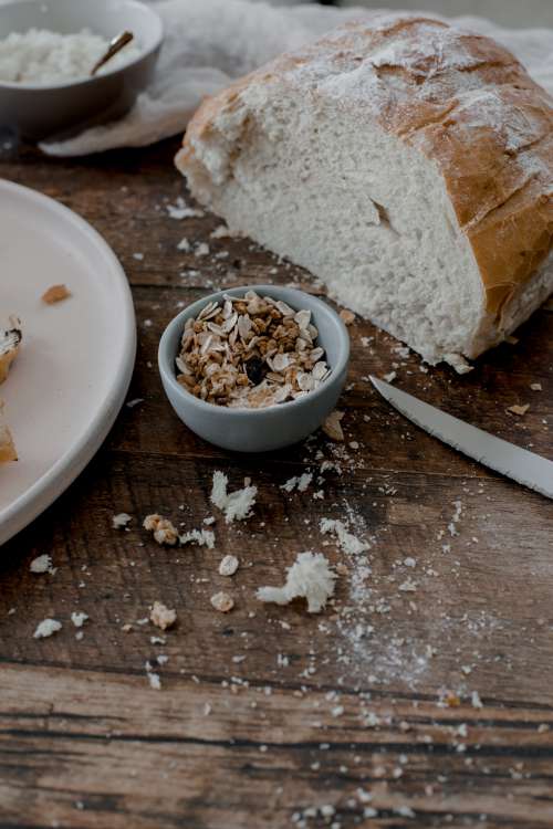 Fresh Baked Bread With Oats On Rustic Table Photo