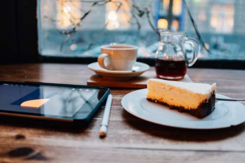 Tablet And Pen With Coffee And Cake Photo