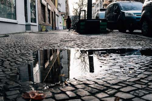 Puddle Reflects The Architecture Above Photo