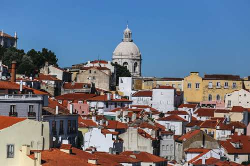 Church Spire Over Lisbon Rooftops Photo