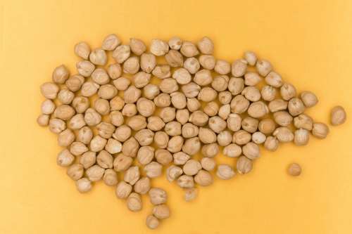 Dried Chick Peas On Yellow Background Photo