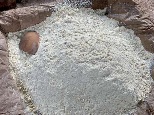 gari, cassava flour, local kitchen, cooking, manioc flour production, local factory, wooden ladle, traditional