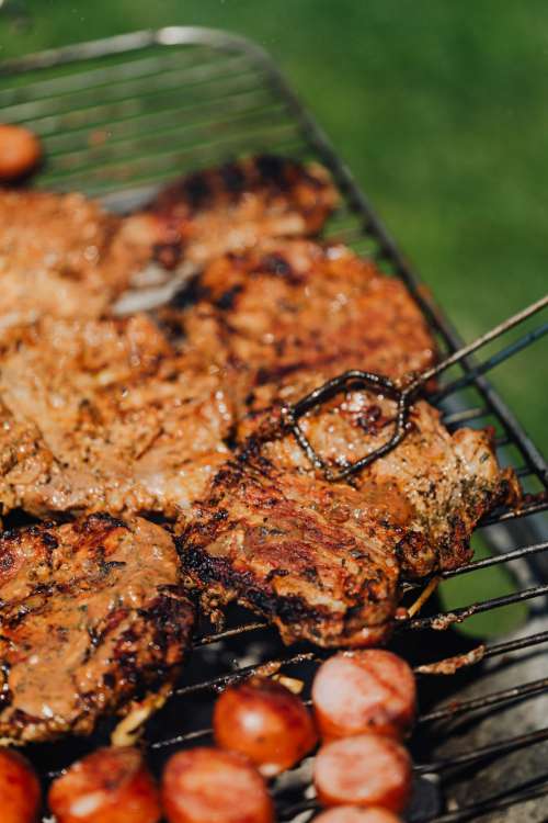 The pork neck is roasted on the grill