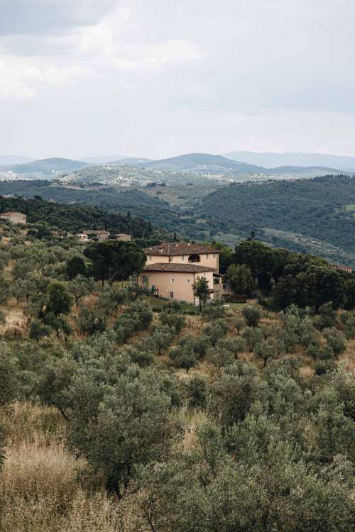 House Nestled Within The Mountains Photo