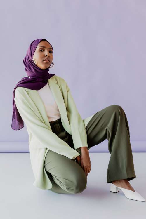 Woman Kneels In Green And Purple Photo