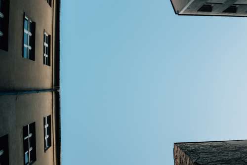 Blue Skies Above Buildings Photo