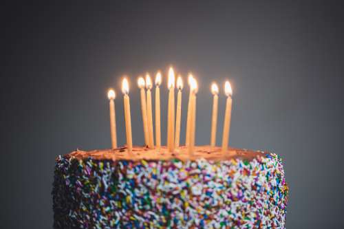 Candles Lit On Chocolate Cake Photo