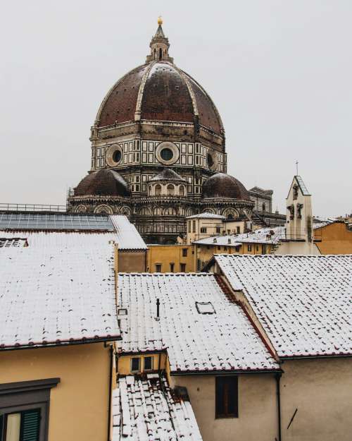 A Tall Cathedral In The Snowy Town Photo