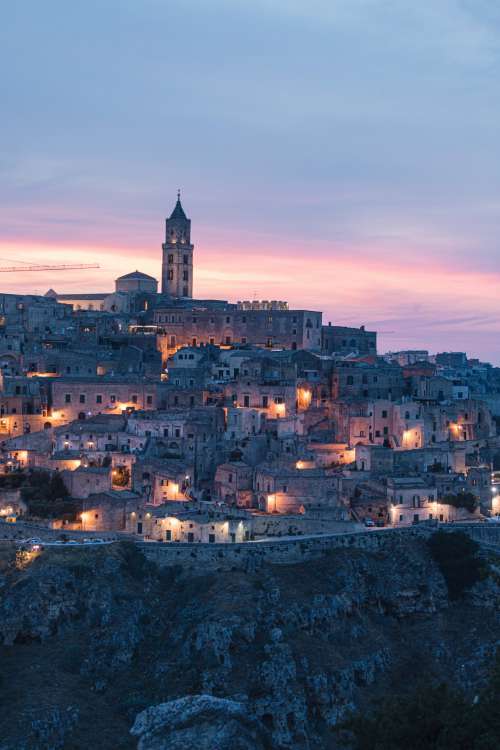 Ancient Mountain Side City At Sunset Photo