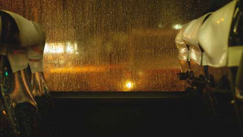 Rain Drops Cascading Down Bus Window Photo